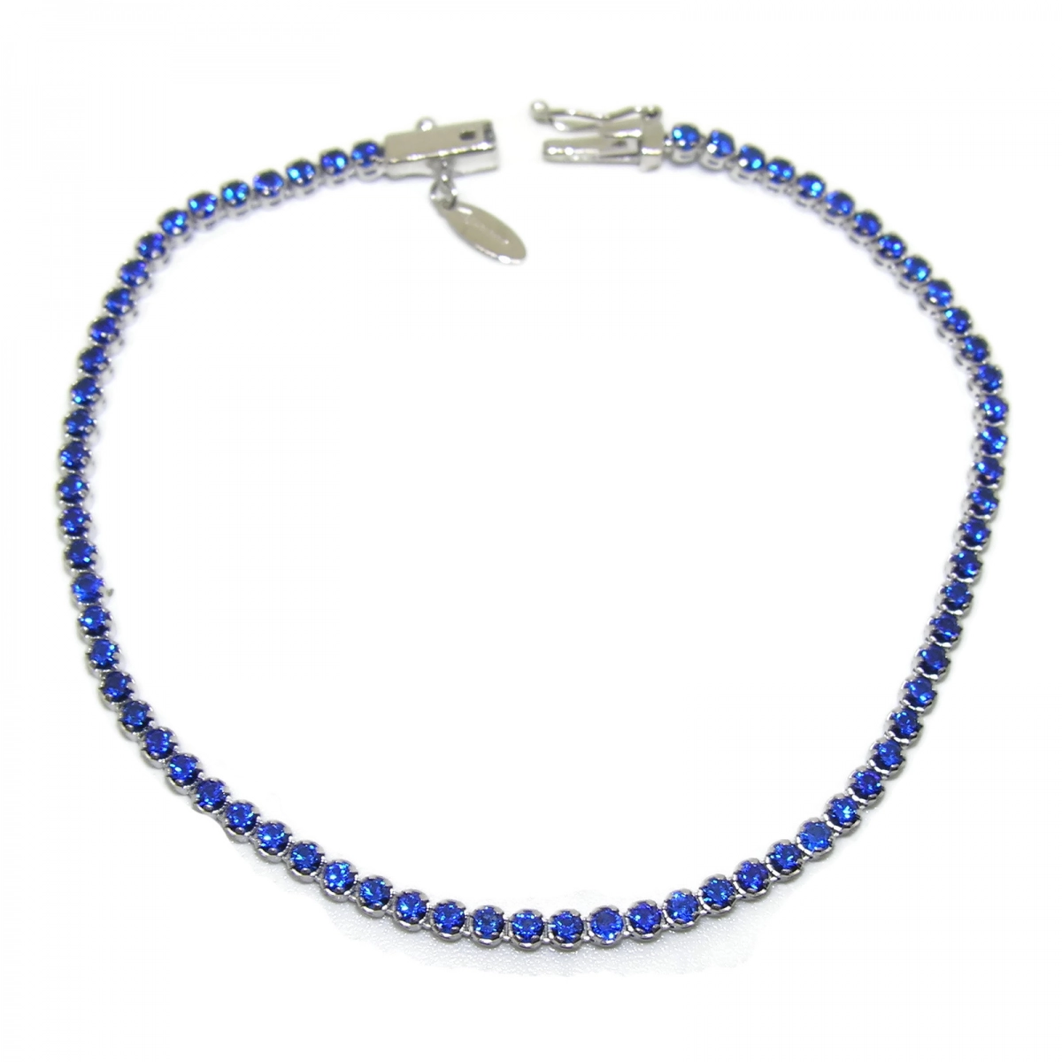 BRACELET TYPE RIVIERE IN 18K WHITE GOLD WITH 70 ZIRCONS BLUE OF THE BEST QUALITY. 18.5 CM NEVER SAY NEVER